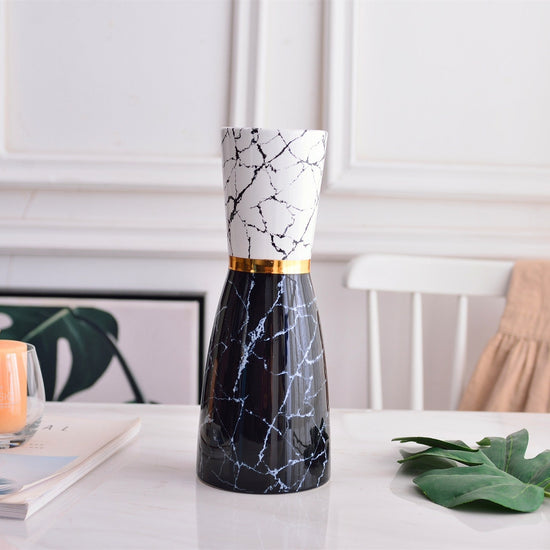 Modern golden ceramic vase with marbled design, light luxury style, simple and elegant for home decor.