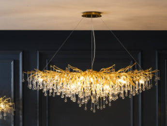 Decorbites luxurious chandelier with water drop crystal accents, modern light design, perfect for elegant home decor.