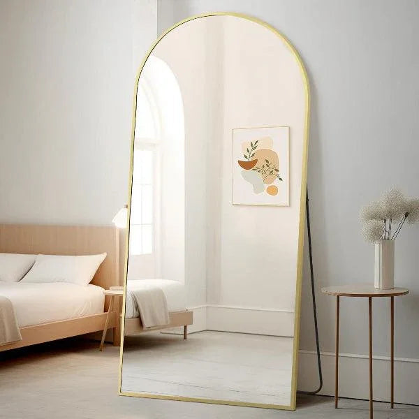 Large arched gold mirror by MIRRORONS, full-length floor mirror for bedroom or living room, hangs or leans for versatile decor.