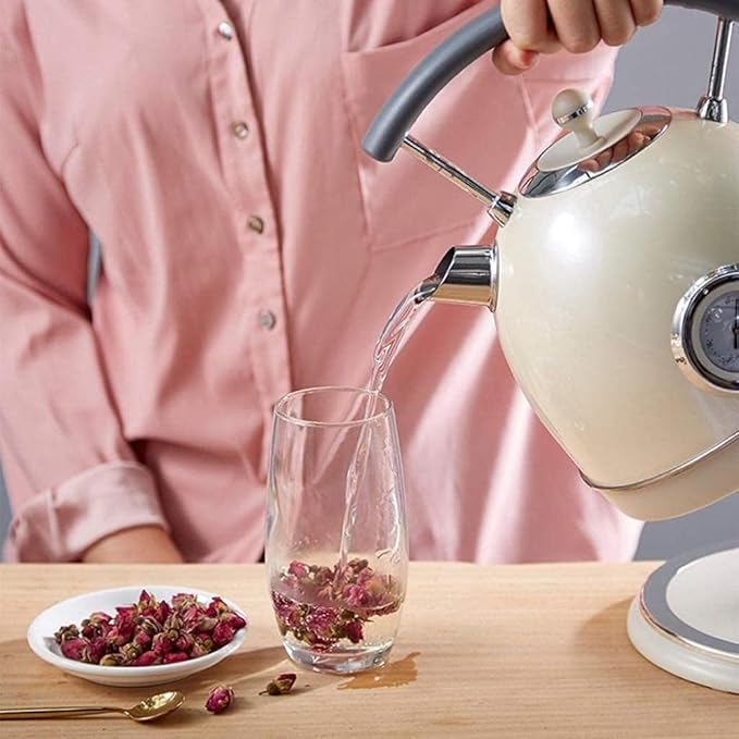 SmartPursue™ electric kettle with built-in thermometer, featuring a sleek design and easy pour spout for boiling water.