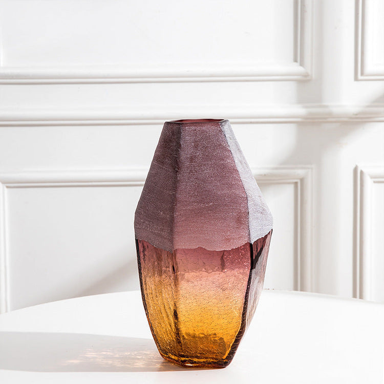 Set of three handmade blown glass vases with geometric faceted shapes in ombre purple amber finish, ideal for home decor.