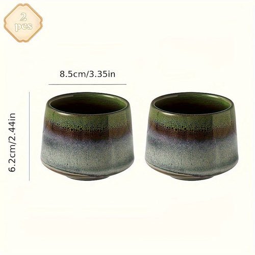 Two ceramic cups with green and brown gradient on a white background, with measurements displayed.