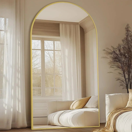 Oversized freestanding arched floor mirror with gold aluminum frame, full-length design, and elegant contemporary style.