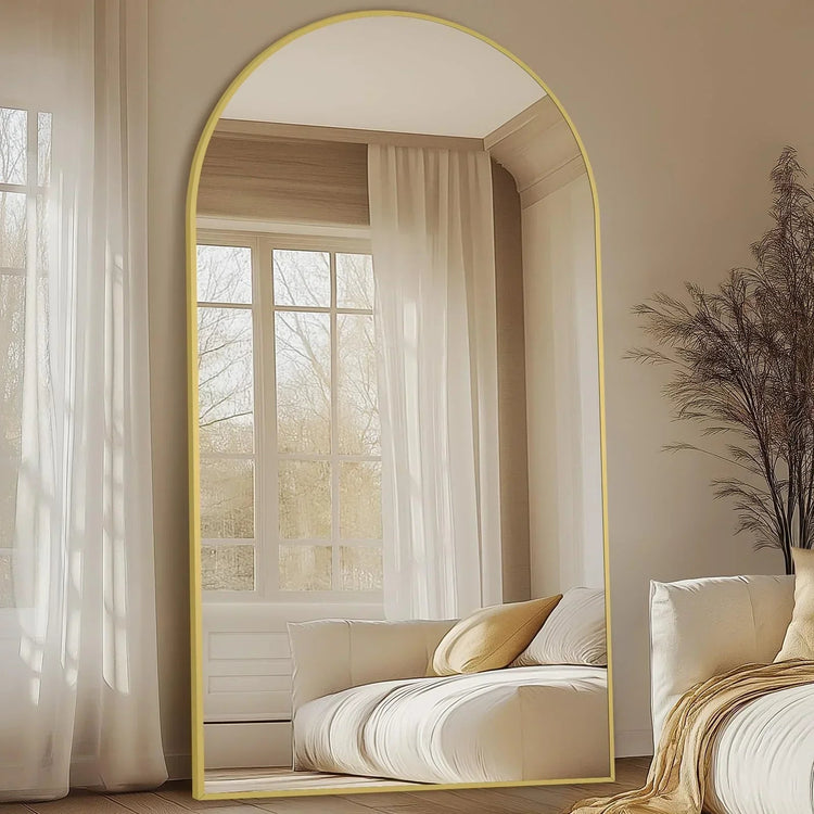 Oversized freestanding arched floor mirror with gold aluminum frame, full-length design, and elegant contemporary style.