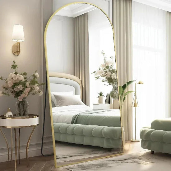 Large arched full-length mirror by MIRRORONS with a gold frame, perfect for bedroom, living room, or gym, hanging or leaning.