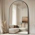 Oversized freestanding arched full-length mirror with a gold aluminum frame, designed for elegant home decor.