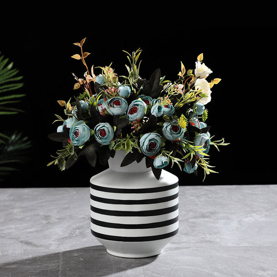 Black and white striped ceramic vase with a modern, light luxury design, perfect for contemporary home decor.