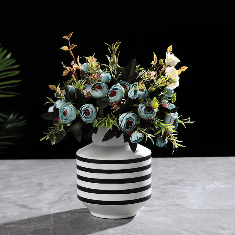 Black and white striped ceramic vase with a modern, light luxury design, perfect for contemporary home decor.