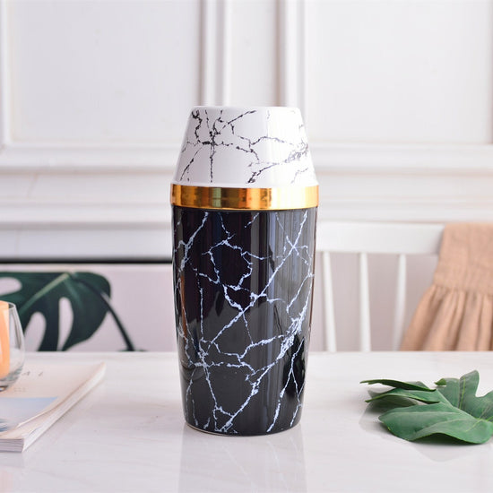 Modern marble and gold ceramic vase by FLIPSTYLEZLLC, featuring a sleek, simple design with elegant marbled patterns.