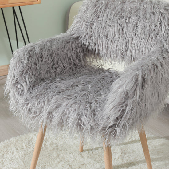 Grey faux fur upholstered dining chair with metal legs, modern V.I.P Digital Presence furniture for stylish dining rooms