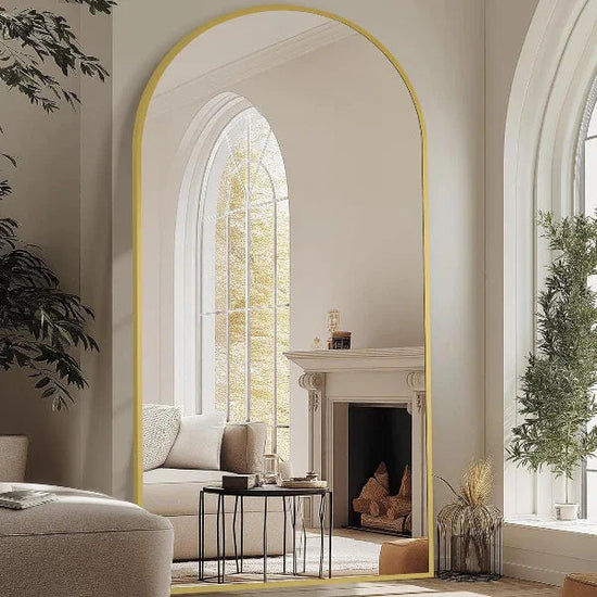 Full-length arched mirror with gold aluminum frame, shatterproof tempered glass, freestanding or wall-mounted by MIRRORONS.