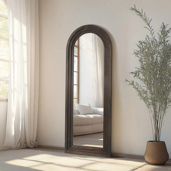 Arched full-length MIRRORONS farmhouse-style floor mirror with solid wood frame, shatterproof tempered glass, freestanding design.