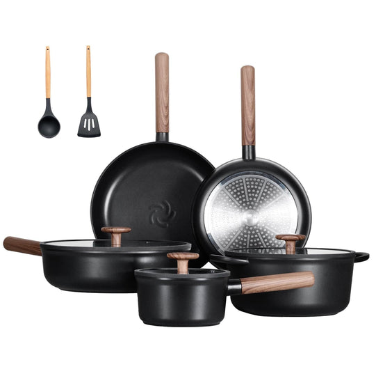 Set of black cookware with wooden handles on a white background