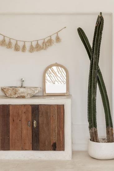 Handmade arch rattan wall mirror with natural boho design, featuring a woven rattan frame, ideal for stylish home decor.
