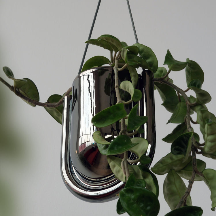 Chrome Misewell Portico planter with a sleek, modern design, featuring a shiny chrome finish and a sturdy pot shape.