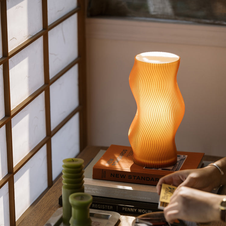 Terra Labs Woogie Table Lamp with a modern, playful design, featuring a soft glow and a unique shape suitable for contemporary decor.