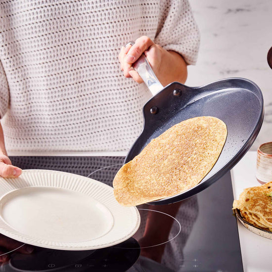 Alva Cookware 10-inch crepe and egg pan with non-stick surface, ideal for making pancakes and breakfast dishes.