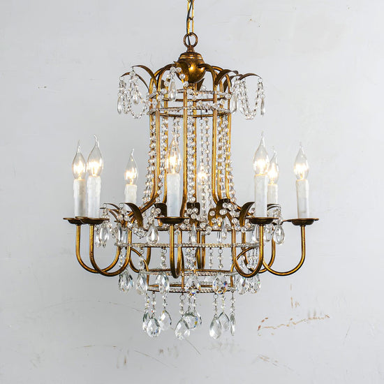 Early American Mooiehome chandelier, 25.2 inches tall with classic design, featuring multiple candle-style lights and antique finish.