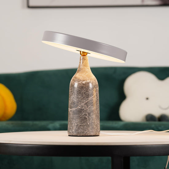 Mooiehome Eddy 12.6-inch table lamp with a sleek modern design and a cylindrical white lampshade on a round base.