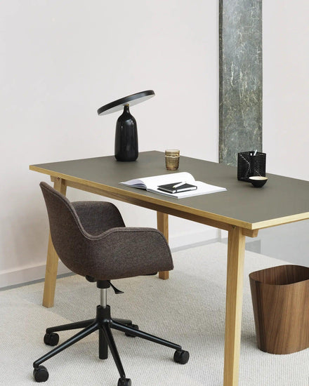 Mooiehome Eddy 12.6-inch table lamp with a sleek modern design and neutral-colored lampshade on a wooden side table