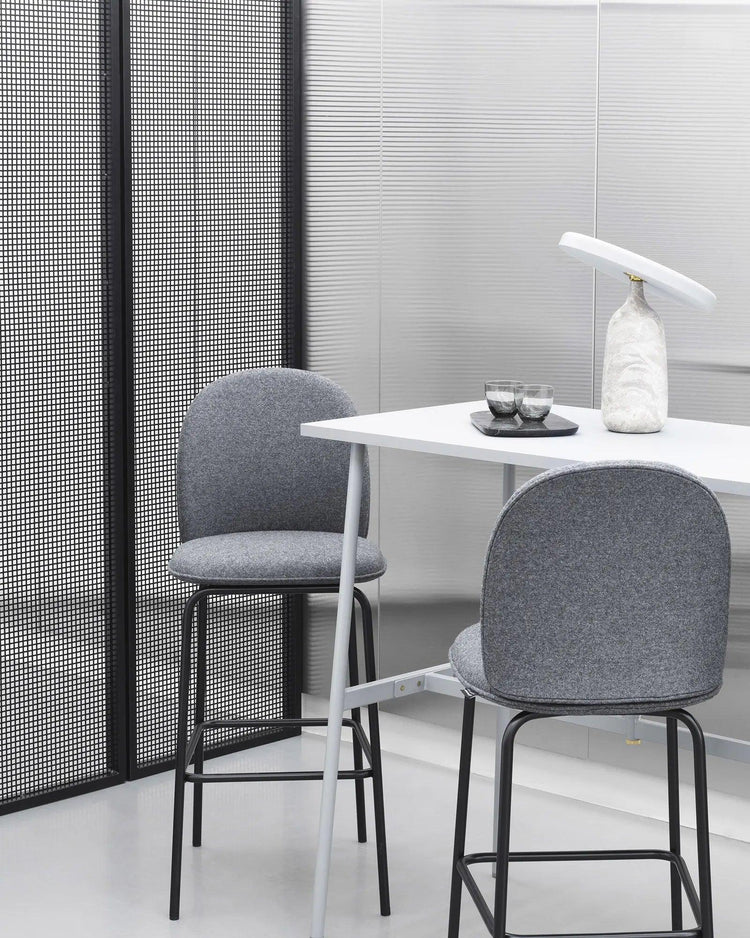 Mooiehome Eddy 12.6-inch table lamp with a sleek design and neutral-colored lampshade on a wooden surface.