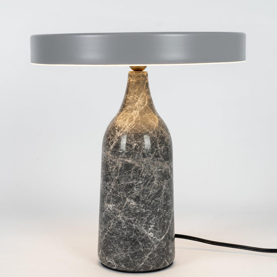 Mooiehome Eddy 12.6-inch table lamp with a modern design, featuring a sleek base and a cylindrical fabric lampshade.