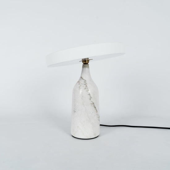 Mooiehome Eddy 12.6-inch table lamp with a sleek modern design, featuring a round base and a cylindrical lampshade.