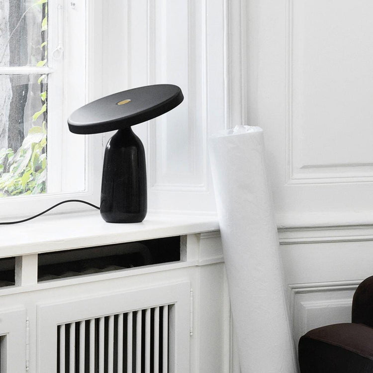 Mooiehome Eddy 12.6-inch table lamp with a sleek modern design and a white lampshade on a wooden base.