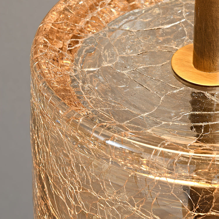 Eira Crackle Mooiehome table lamp with textured crackle finish and modern design, illuminated on a stylish side table.