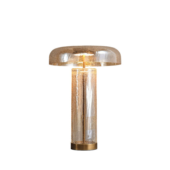 Eira Crackle Table Lamp by Mooiehome with textured ceramic base and fabric shade on a wooden side table.