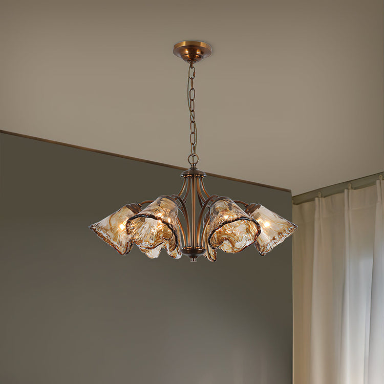 Elvarin Chandelier by Mooiehome featuring elegant crystal accents and a modern metal frame, hanging in a stylish living space.