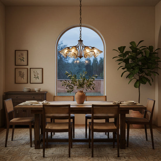Elvarin chandelier by Mooiehome featuring elegant hanging glass and metal design with warm lighting for sophisticated interiors.