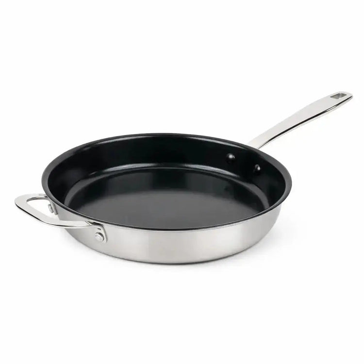 Alva Cookware frying pan with non-stick surface and ergonomic handle, shown from a side angle on a stovetop.