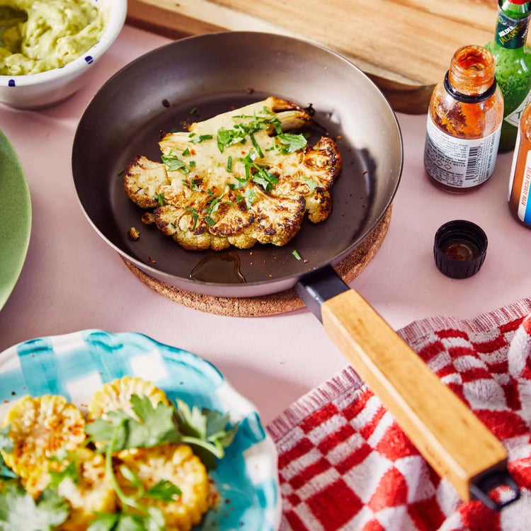 Alva Cookware frying pan with non-stick surface, stainless steel handle, and cooking surface visible in the image.