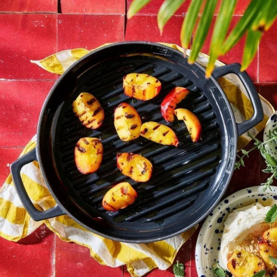 11-inch Alva Cookware grill pan with ridged surface for grilling indoors, featuring a sturdy handle and non-stick coating.