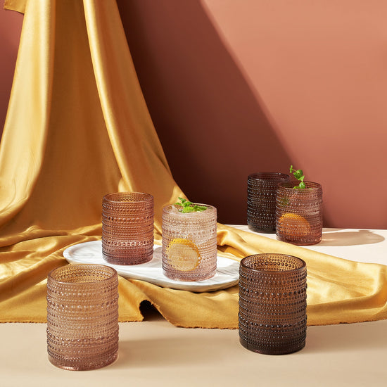 Set of six Venus Hobnail lowball tumblers from Khen Site, 11oz brown glass drinkware with textured hobnail pattern, close-up view.