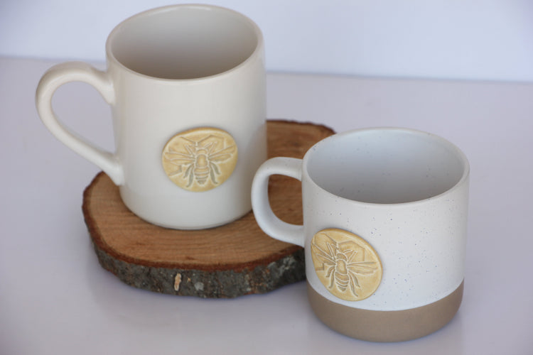 Ceramic bee-shaped mug from prodigalpottery with a detailed honeybee design, ideal for coffee or tea.