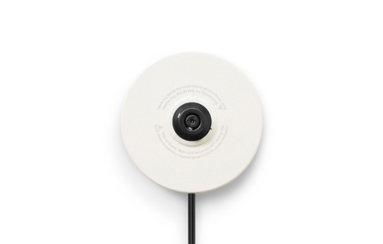 White BALMUDA The Kettle with sleek design and white base, showcasing modern electric kettle with a minimalist aesthetic.