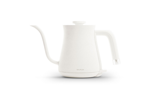 White BALMUDA The Kettle with sleek design, front view showing the modern, minimalist electric kettle for boiling water.