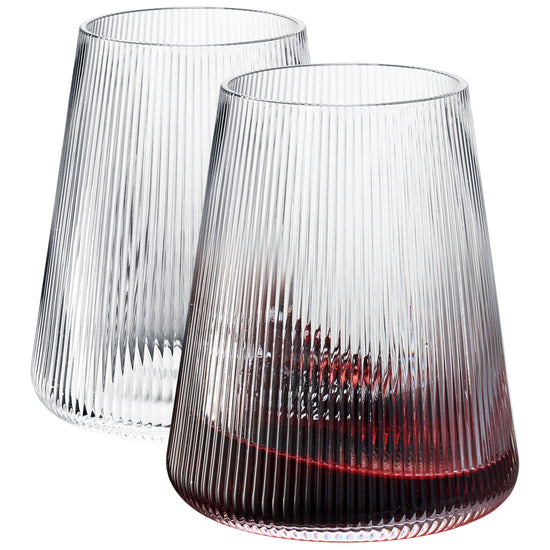 Set of 2 Khen Stemless wine glasses, 13.5 oz clear modern glassware with ribbed design and slanted shape.