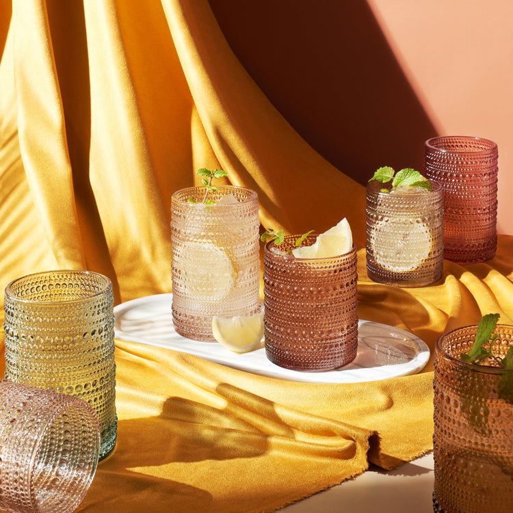 Set of 12 Khen Site highball and lowball glasses with hobnail texture, including 14 oz highballs and 11 oz lowballs.