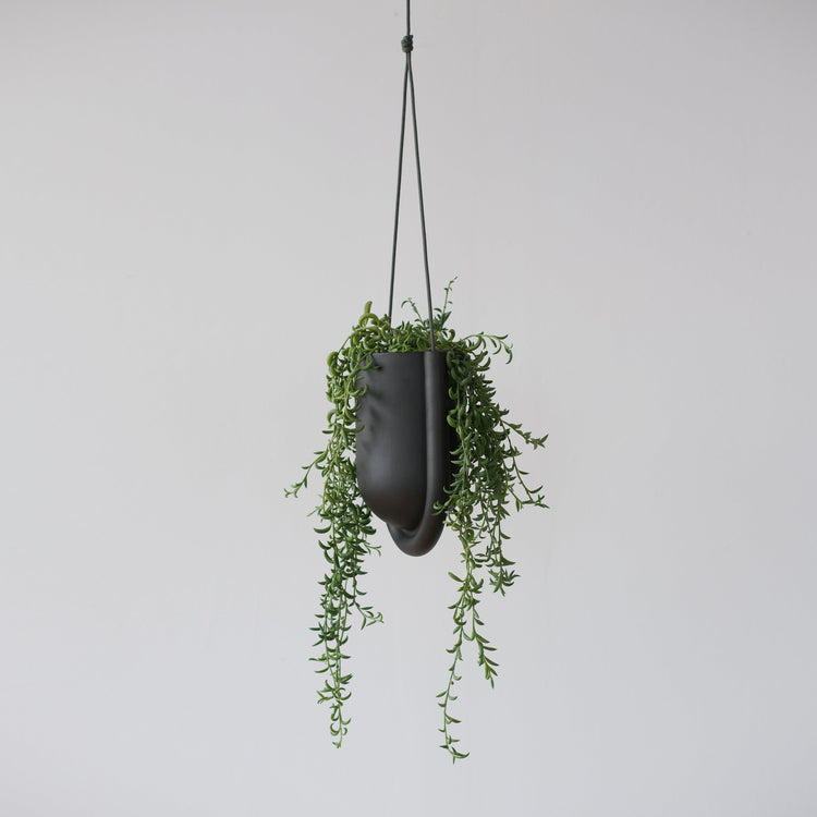 Black Misewell Portico planter with a sleek, modern design, perfect for indoor or outdoor decorative plant displays.