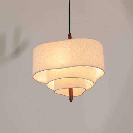 Decorative fabric chandelier light fixture by DECORBITES with soft, flowing fabric shades and elegant hanging design.