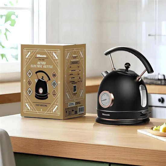 SmartPursue™ electric kettle with built-in thermometer, stainless steel body, and ergonomic handle for boiling and temperature control.