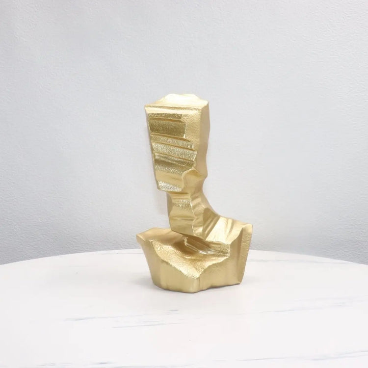 Modern abstract resin sculpture featuring artistic character forms, decorative accent piece for contemporary interior decor.