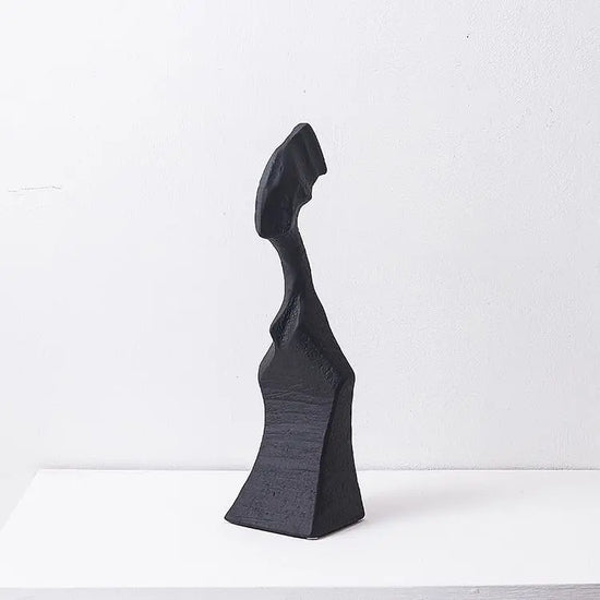 Modern resin sculpture featuring abstract character designs, decorative art piece for contemporary interior decor by Decorbites.