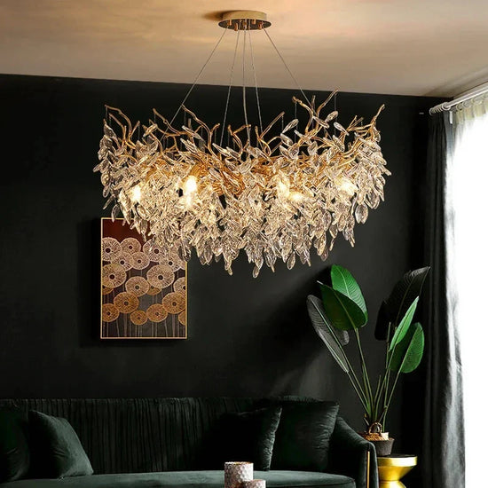 Gold crystal LED chandelier by DECORBITES featuring sparkling crystals and modern design, illuminated with warm LED lights.
