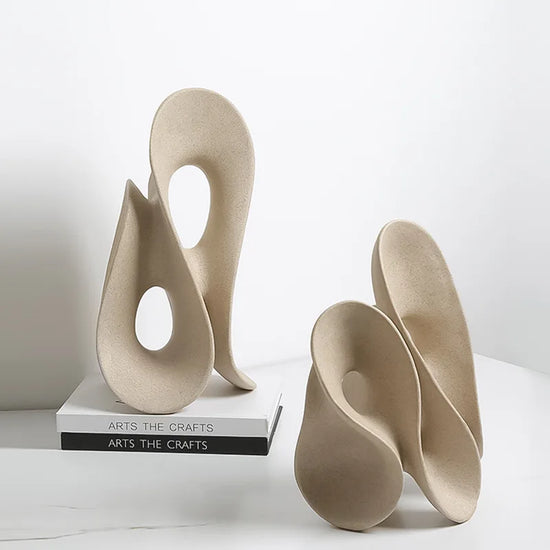 Coral hollow resin sculpture of an abstract human figure, modern home decor accent piece by Decorbites, detailed and artistic.