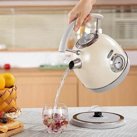 SmartPursue™ electric kettle with built-in thermometer, sleek stainless steel design, perfect for precise hot water boiling.