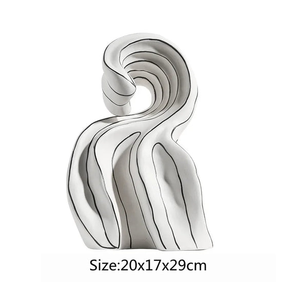 Modern ceramic curl sculpture decor by Decorbites, featuring sleek porcelain art accent with intricate curled design.